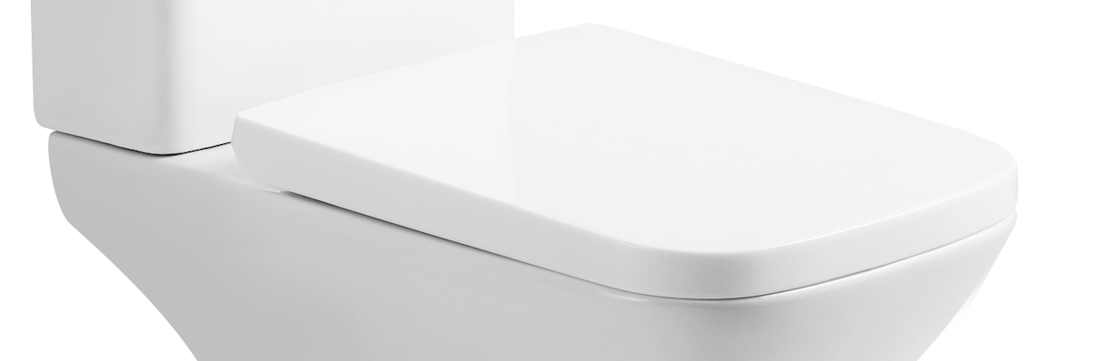 A close-up of the iBathUK Venice PP Seat, a modern white soft close toilet seat with quick release and top fix fittings, shown with its lid closed against a plain white background.