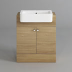 The Harper 2 Door Floorstanding Vanity Unit With Semi Recessed Basin (660mm x 800mm) by iBathUK features a light wood cabinet with square metal handles and two doors, topped with a white semi recessed basin, set against a plain gray background.