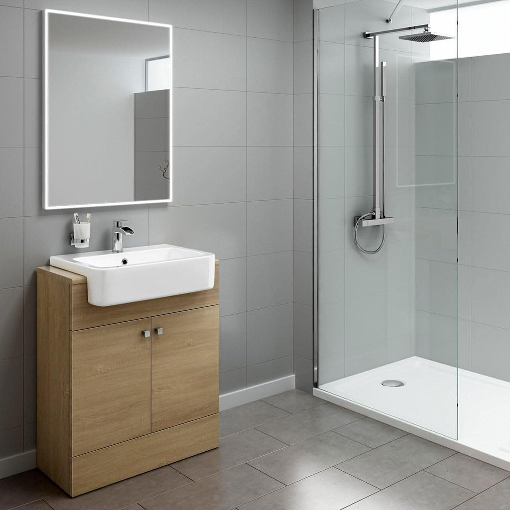 Modern bathroom featuring the iBathUK Harper 2 Door Floorstanding Vanity Unit with Semi Recessed Basin (660mm x 800mm), a large illuminated mirror, glass-enclosed rainfall shower, and light gray tiled walls and floor.