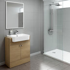 Modern bathroom featuring the iBathUK Harper 2 Door Floorstanding Vanity Unit with Semi Recessed Basin (660mm x 800mm), a large illuminated mirror, glass-enclosed rainfall shower, and light gray tiled walls and floor.
