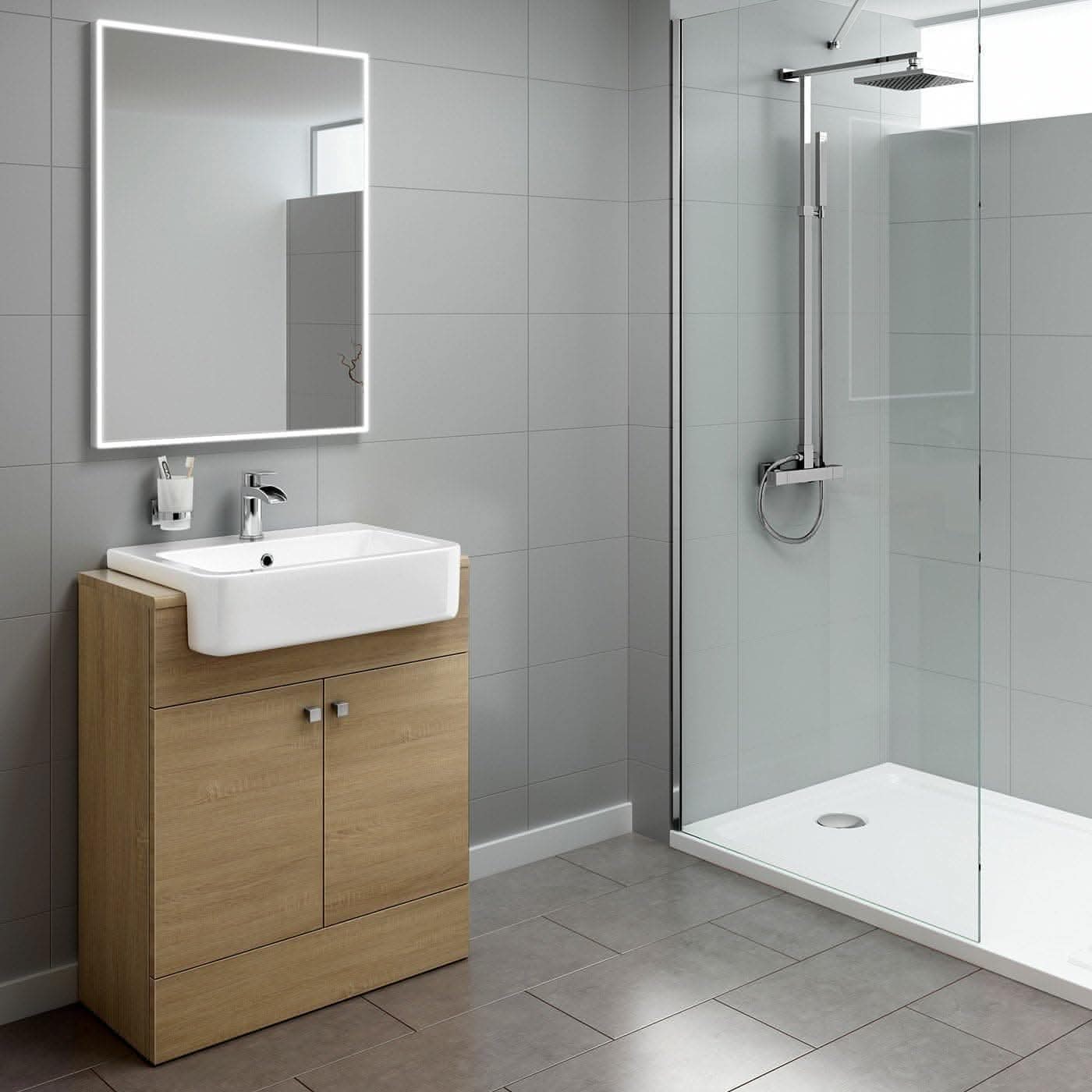 Modern bathroom featuring the iBathUK Harper 2 Door Floorstanding Vanity Unit with Semi Recessed Basin (660mm x 800mm), a large illuminated mirror, glass-enclosed rainfall shower, and light gray tiled walls and floor.
