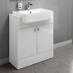 The iBathUK Harper 2 Door Floorstanding Vanity Unit with Semi Recessed Basin (660mm x 800mm) stands against a gray tiled wall and floor, featuring a chrome faucet and wall-mounted toothbrush holder next to the sink.