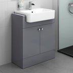 The iBathUK Harper 2 Door Floorstanding Vanity Unit With Semi Recessed Basin (660mm x 800mm) features a glossy gray cabinet, chrome fittings, and is set against light gray tiled walls and floor.