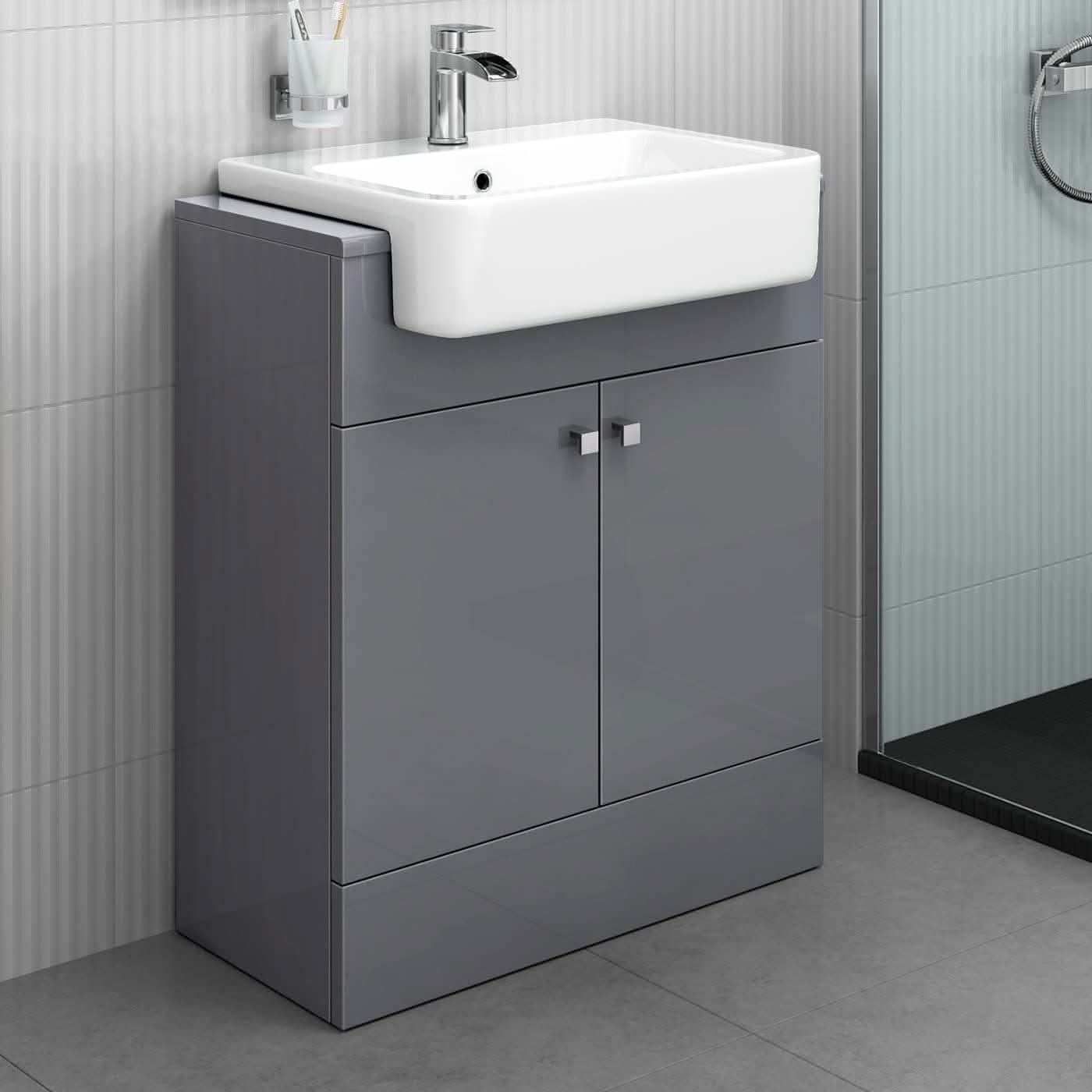 The iBathUK Harper 2 Door Floorstanding Vanity Unit With Semi Recessed Basin (660mm x 800mm) features a glossy gray cabinet, chrome fittings, and is set against light gray tiled walls and floor.