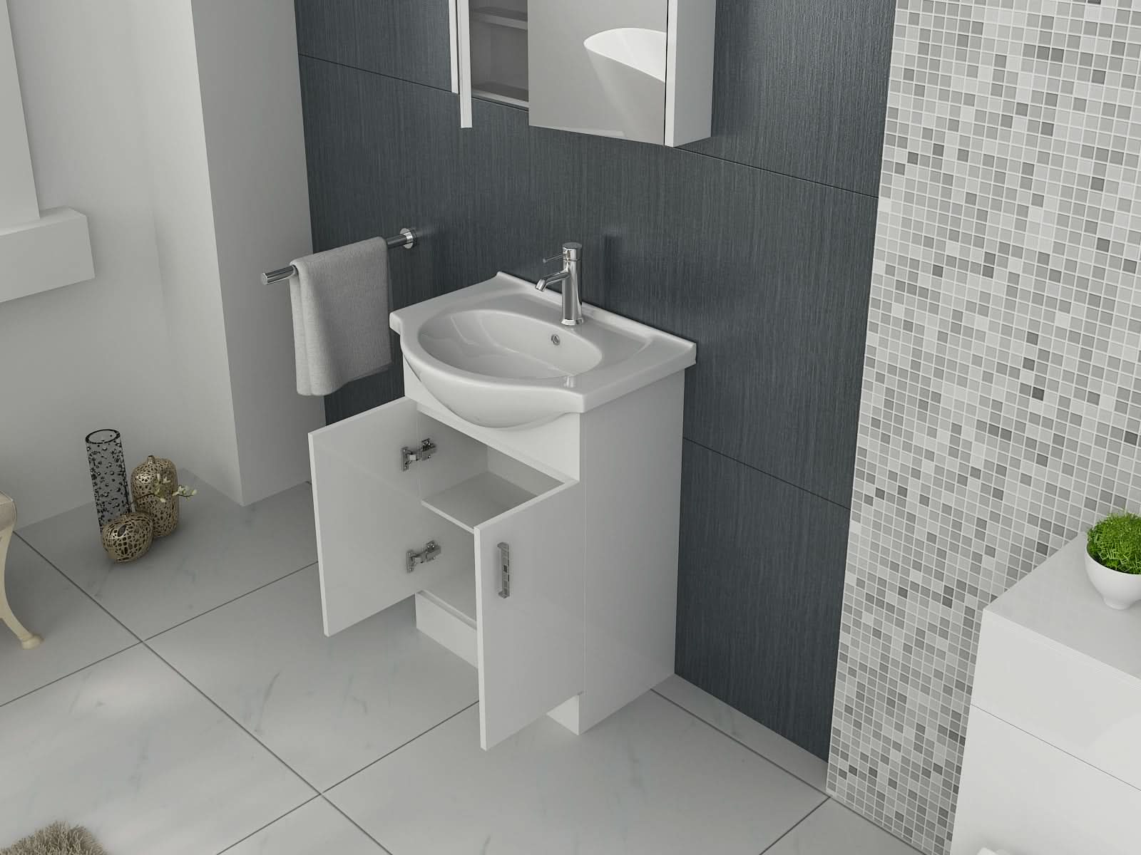 The iBathUK Quartz MDF Gloss White Vanity Unit with Basin features open cabinet doors revealing moisture-resistant MDF shelves. Gray and mosaic tiles line the wall, with a towel beside the sink and decor accents on the floor.