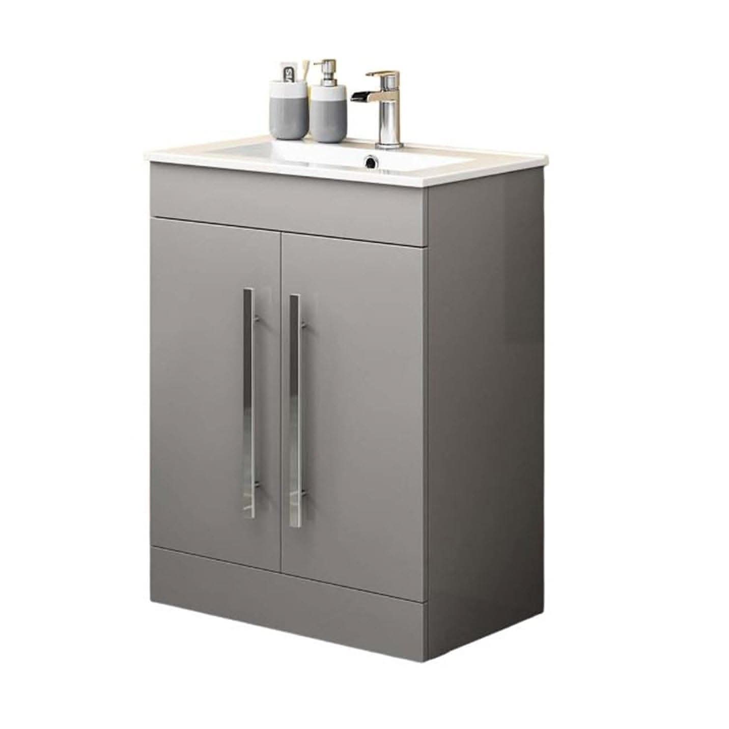 A modern gray iBathUK Avon 2 Door Floorstanding Vanity Unit With Basin (615mm x 815mm, 1 tap hole), featuring long vertical handles and three toiletries beside a sleek silver faucet.